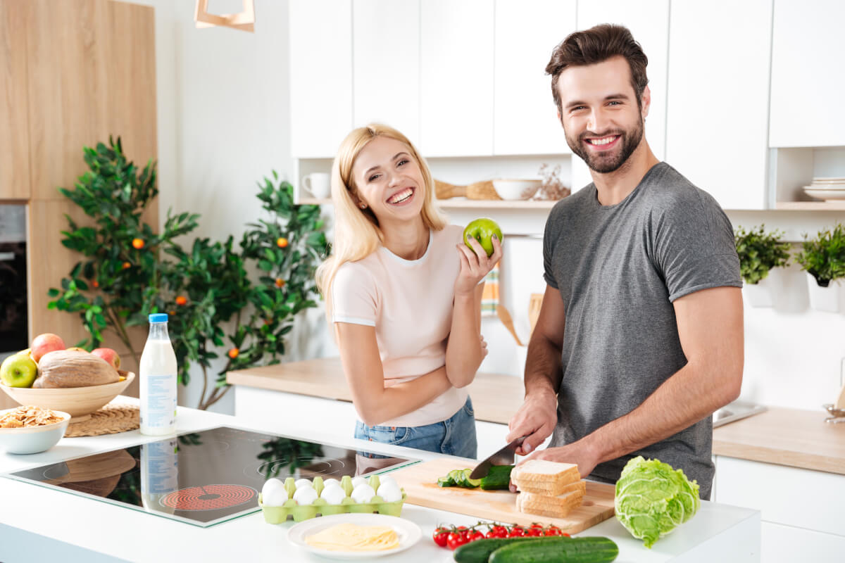 smiling couple spending time together kitchen
