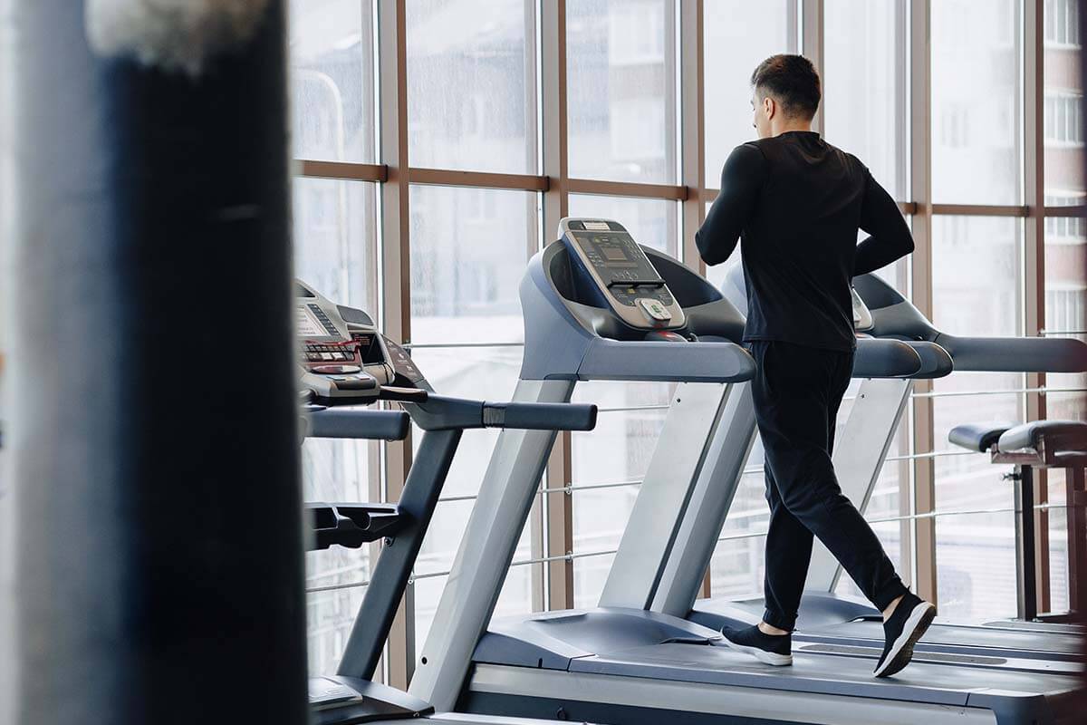 stylish guy gym is training treadmill healthy lifestyle